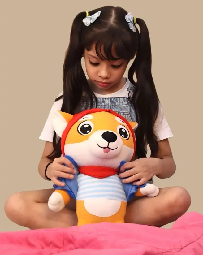 Child holding aurbo animal plush toy with a beige background