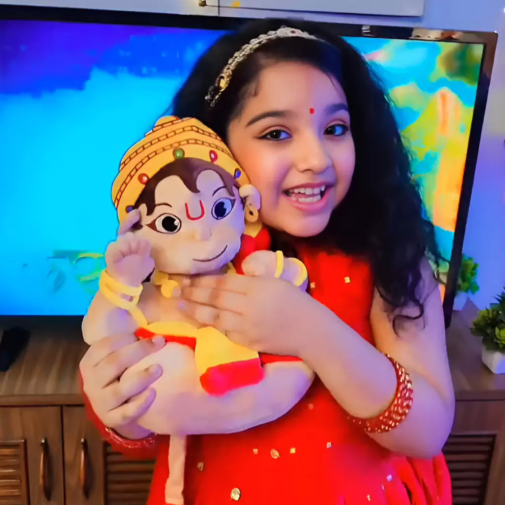 little girl with aurbo mantra chanting baby hanuman plush toy